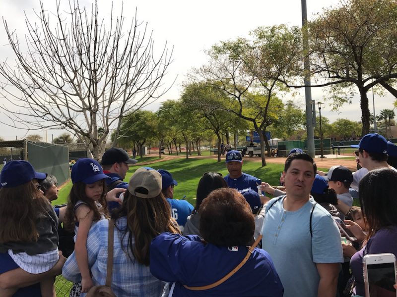 Players signing autographs in Glendale, Arizona
