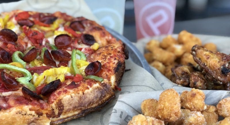 A Pieology pizza, tater tots, and wings at the Rancho Mirage, California location 