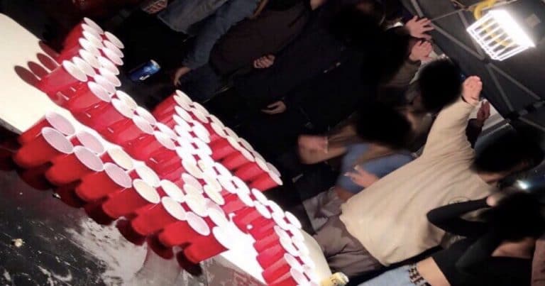 Photo surfaces appearing to show OC students giving Nazi salute to red solo cup swastika
